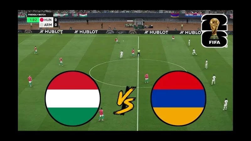 Cầu thủ Hungary chạy nhanh với bóng trước sự truy đuổi của cầu thủ Armenia Cầu thủ Hungary chạy nhanh với bóng trước sự truy đuổi của cầu thủ Armenia